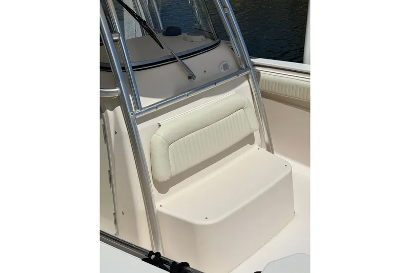 Slide: The Image of 2006 Grady-White Bimini 306 boat seating area with cushioned backrest and stainless steel frame. - 9