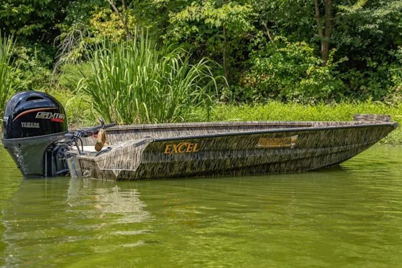 The Image of 2026 Excel 183 Tomahawk boat with Yamaha engine on a serene lake. - 0