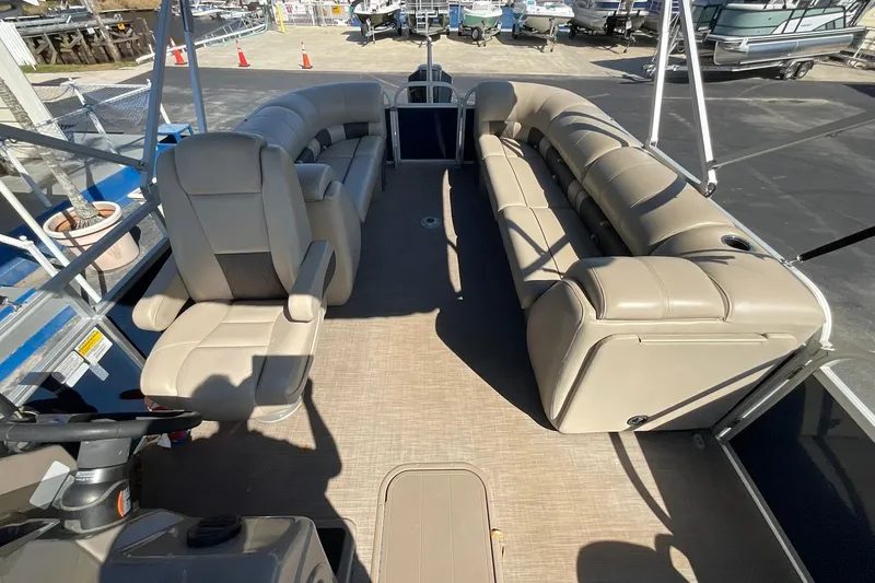 Slide: The Image of 2020 Sun Tracker Party Barge 22 XP3 interior with beige seating and spacious layout. - 13