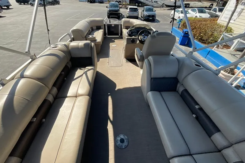 Slide: The Image of 2020 Sun Tracker Party Barge 22 XP3 interior with spacious seating and steering console. - 15