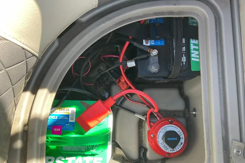 Slide: The Image of Battery compartment of a 2020 Sun Tracker Party Barge 22 XP3 with wiring and switch. - 18