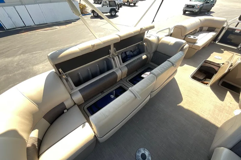 Slide: The Image of 2020 Sun Tracker Party Barge 22 XP3 interior with open storage compartments. - 19