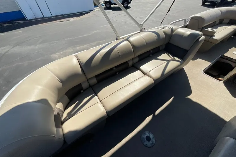 Slide: The Image of 2020 Sun Tracker Party Barge 22 XP3 with spacious beige seating on deck. - 20