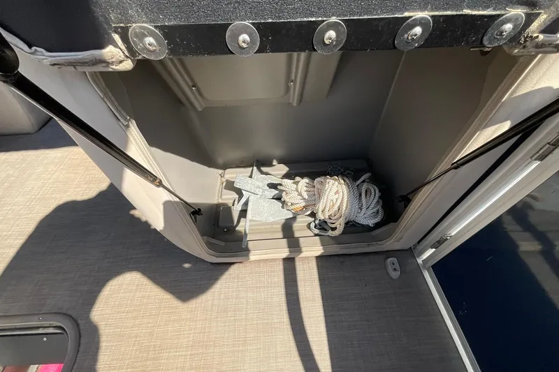 Slide: The Image of Storage compartment with anchor and rope on 2020 Sun Tracker Party Barge 22 XP3. - 24