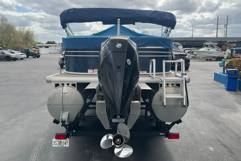 Slide: The Image of 2020 Sun Tracker Party Barge 22 XP3 pontoon boat with outboard motor in parking lot. - 3