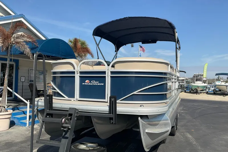 Slide: The Image of 2020 Sun Tracker Party Barge 22 XP3 pontoon boat on trailer, parked outdoors. - 5