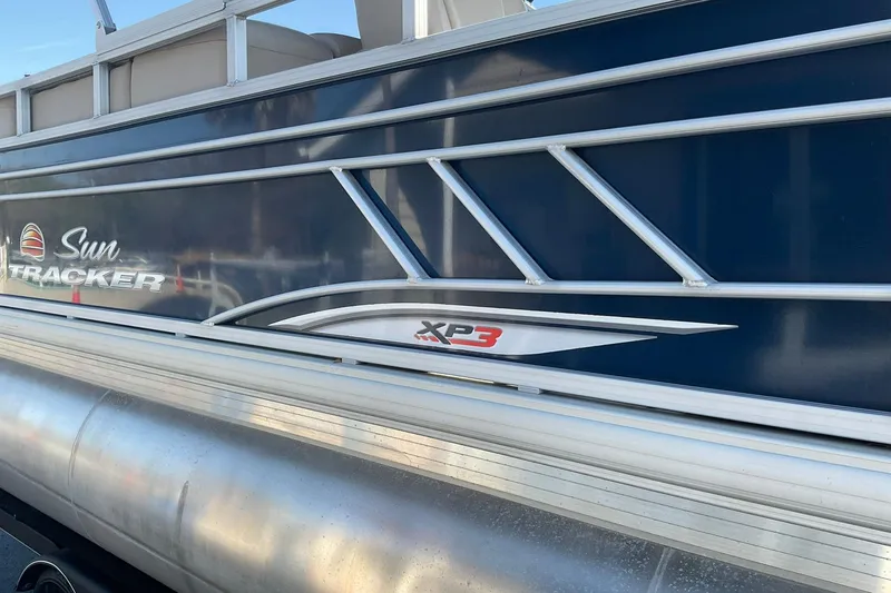 Slide: The Image of 2020 Sun Tracker Party Barge 22 XP3 pontoon boat side view with logo. - 7