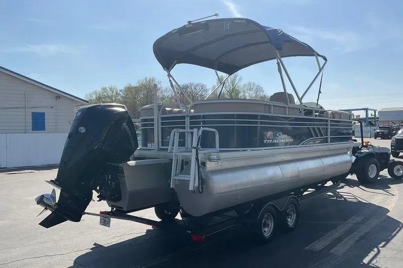 Slide: The Image of 2020 Sun Tracker Party Barge 22 XP3 pontoon boat on trailer, parked outdoors. - 8