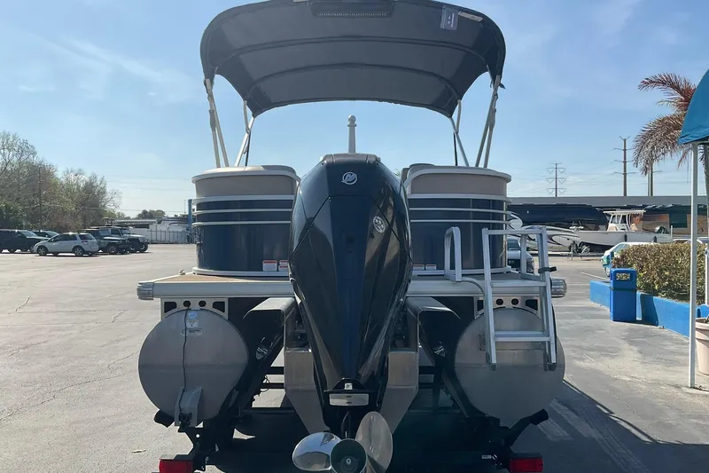 Slide: The Image of 2020 Sun Tracker Party Barge 22 XP3 pontoon boat with outboard motor in a parking lot. - 9