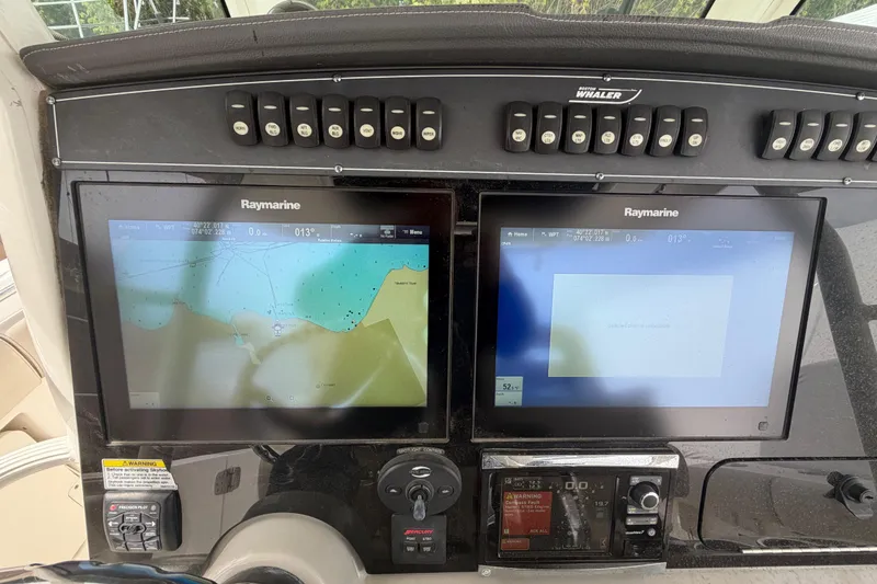 Slide: The Image of Control panel of a 2016 Boston Whaler 330 Outrage with Raymarine displays. - 17
