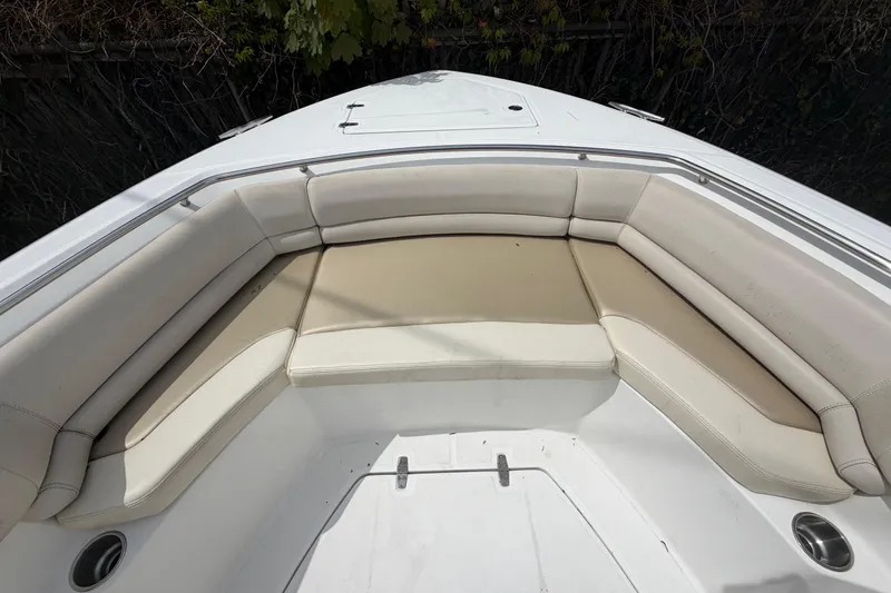 Slide: The Image of 2016 Boston Whaler 330 Outrage boat with spacious cushioned seating area. - 2