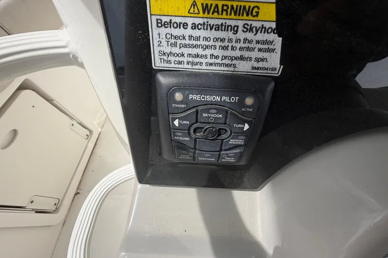 Slide: The Image of Control panel of a 2016 Boston Whaler 330 Outrage boat with warning label. - 22