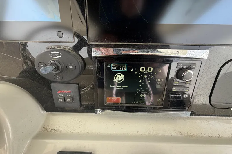 Slide: The Image of Control panel of a 2016 Boston Whaler 330 Outrage boat with digital display. - 24