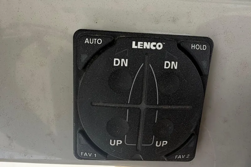 Slide: The Image of Lenco trim tab control panel on 2016 Boston Whaler 330 Outrage boat. - 25