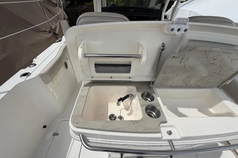 Slide: The Image of Boston Whaler 330 Outrage 2016 boat sink and countertop detail. - 34
