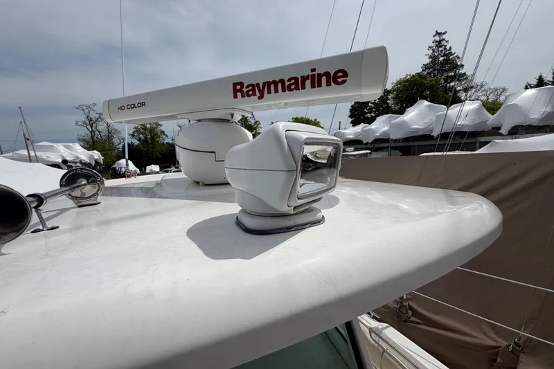 Slide: The Image of Radar and spotlight on 2016 Boston Whaler 330 Outrage boat deck. - 45
