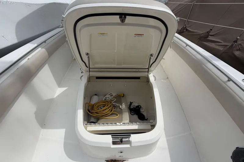 Slide: The Image of Open storage compartment on a 2016 Boston Whaler 330 Outrage boat deck. - 5