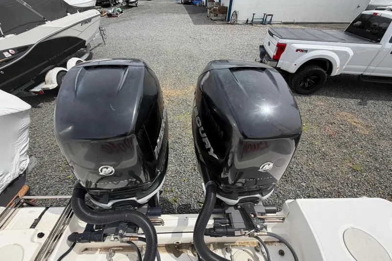 Slide: The Image of Twin Mercury outboard engines on a 2016 Boston Whaler 330 Outrage boat. - 51
