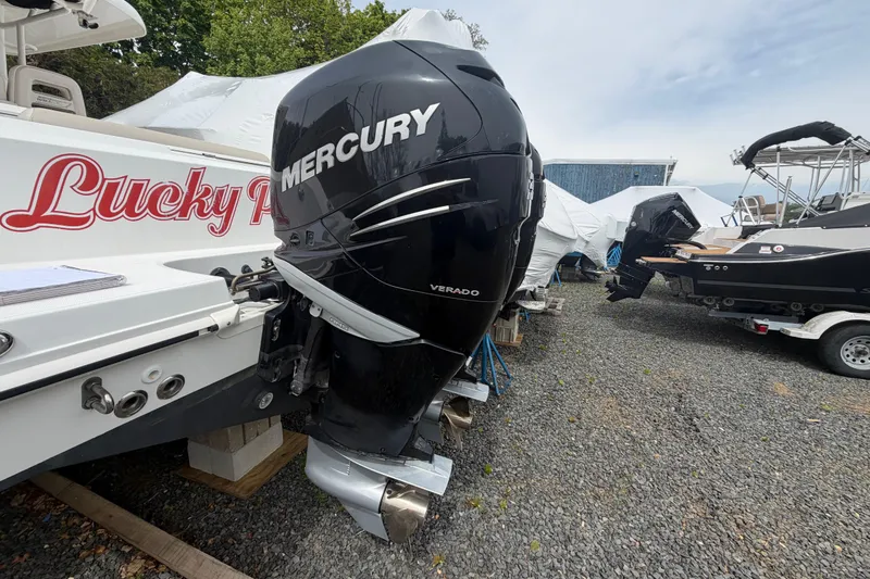 Slide: The Image of Boston Whaler 330 Outrage 2016 with Mercury Verado engine in a boatyard. - 52