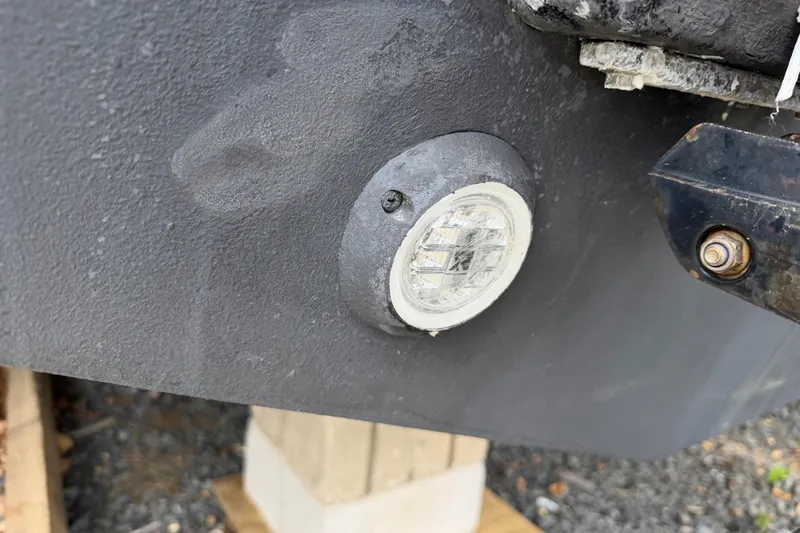 Slide: The Image of Close-up of a 2016 Boston Whaler 330 Outrage boat's hull light fixture. - 55
