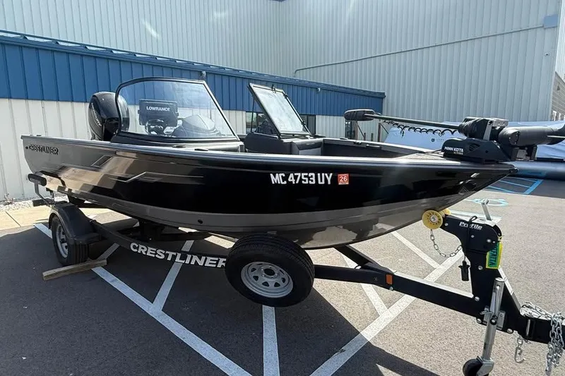 The Image of 2023 Crestliner 1850 Super Hawk WT JS boat on trailer, parked outdoors. - 0