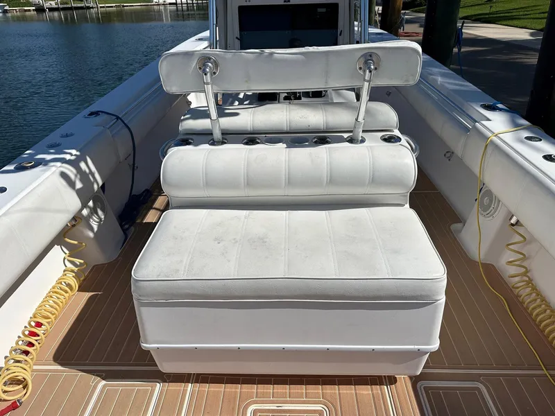 Slide: The Image of 2007 Contender 33 Tournament boat interior with white seating and teak flooring. - 16