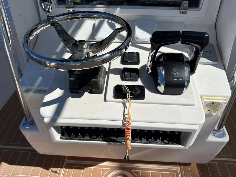 Slide: The Image of 2007 Contender 33 Tournament helm with steering wheel and controls. - 8
