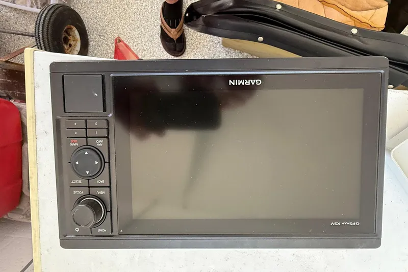 Slide: The Image of Garmin GPSmap XSV device on a 1986 Dolphin 18 Skiff boat. - 4