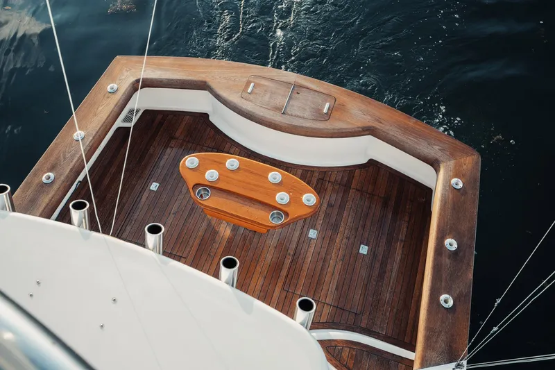 Slide: The Image of 2016 F&S Express boat deck with wooden finish and fishing rod holders. - 24