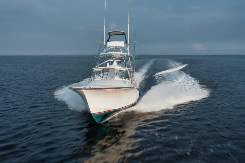 Slide: The Image of 2016 F&S Express boat speeding on open water, creating a dynamic wake. - 4