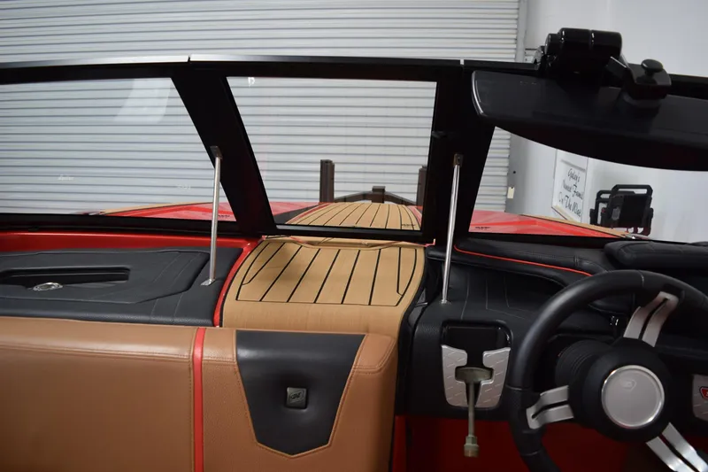 Slide: The Image of 2024 Nautique Ski Nautique interior with sleek dashboard and modern steering wheel design. - 10