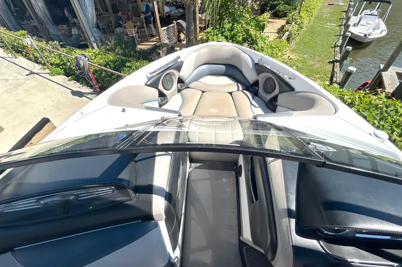 Slide: The Image of Interior view of a 2012 Malibu Wakesetter 247 LSV boat, featuring spacious seating. - 14