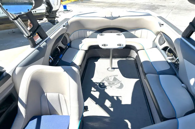Slide: The Image of Interior of a 2012 Malibu Wakesetter 247 LSV boat with seating and table. - 17