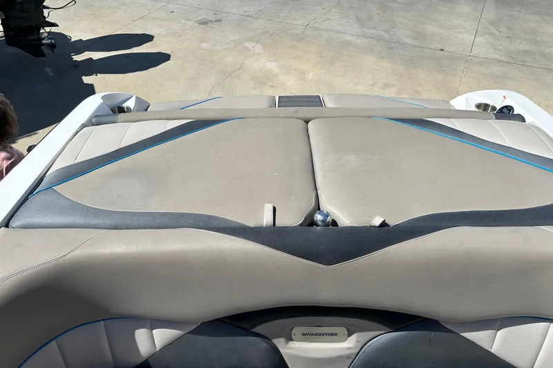 Slide: The Image of 2012 Malibu Wakesetter 247 LSV boat interior with beige and black upholstery. - 20