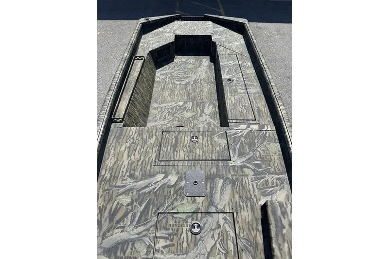Slide: The Image of 2026 SeaArk 1752 Slayer X boat interior with camouflage design and storage compartments. - 5