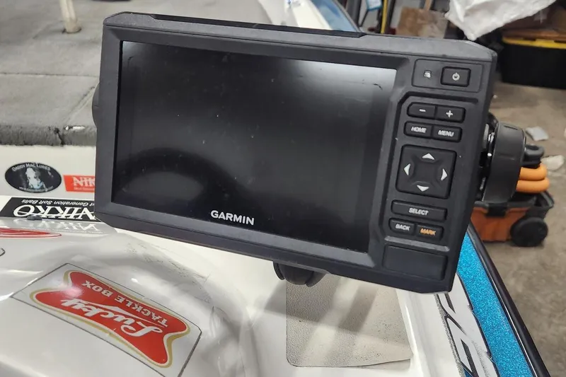 Slide: The Image of Garmin fishfinder on 1997 Stratos 268V 17' SC Bass Boat dashboard. - 5