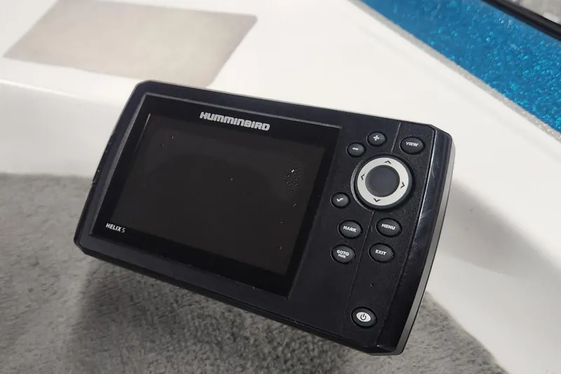 Slide: The Image of Humminbird Helix 5 fish finder on 1997 Stratos 268V bass boat dashboard. - 6