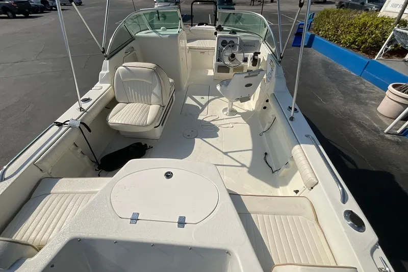 Slide: The Image of 2009 Hydra-Sports Lightning 202 DC boat interior with seating and steering console. - 11