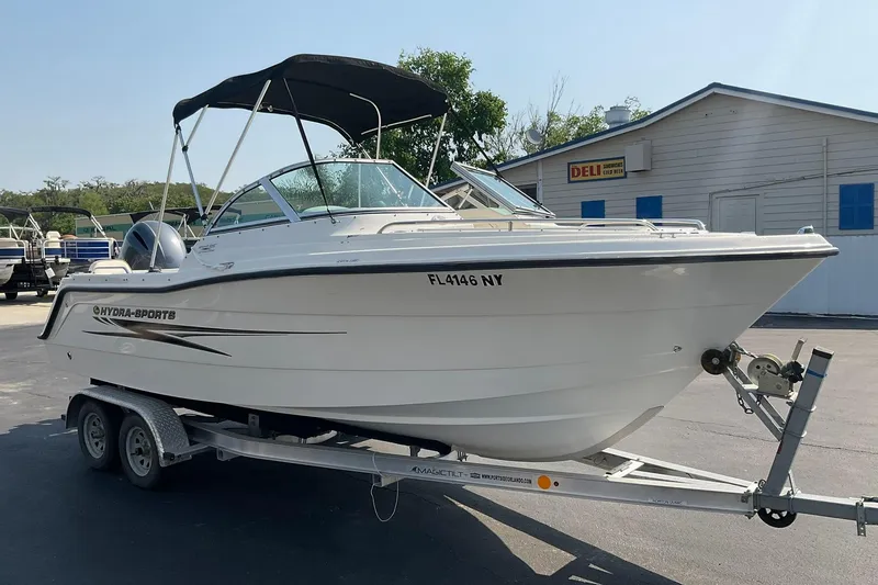 Slide: The Image of 2009 Hydra-Sports Lightning 202 DC boat on trailer, parked outdoors. - 3