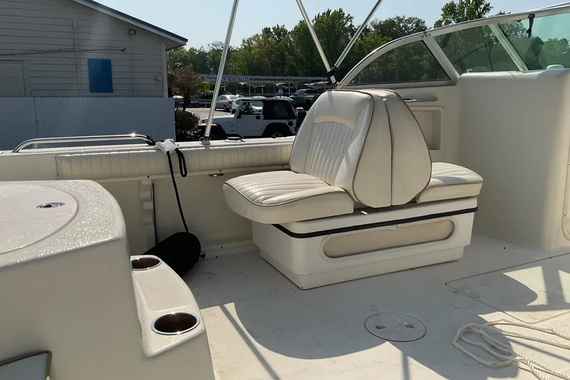 Slide: The Image of 2009 Hydra-Sports Lightning 202 DC boat interior with white seating and cup holders. - 7