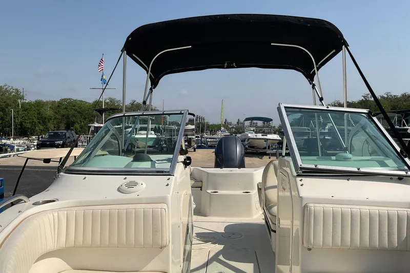 Slide: The Image of 2009 Hydra-Sports Lightning 202 DC boat with canopy at marina dock. - 8