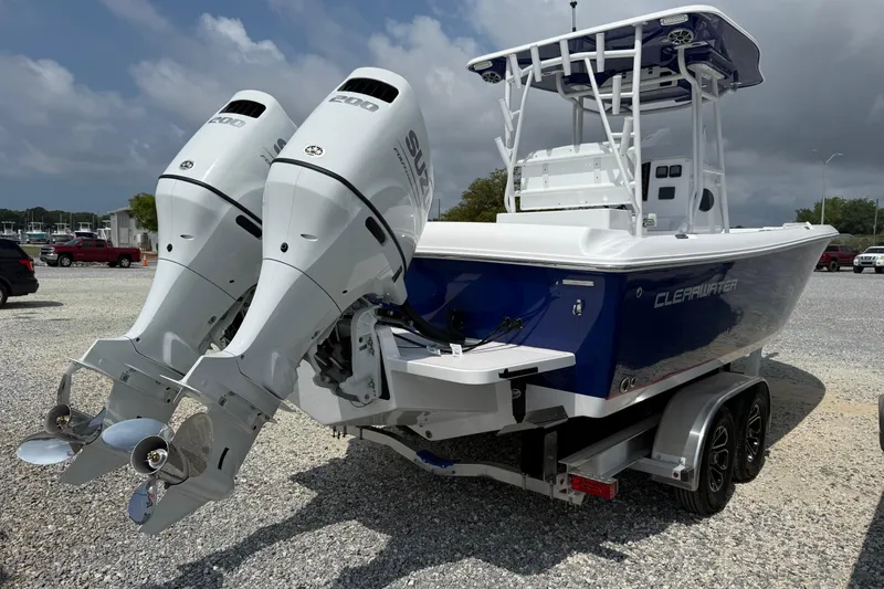 Slide: The Image of 2026 Clearwater 2800 Center Console boat with dual outboard engines on a trailer. - 3