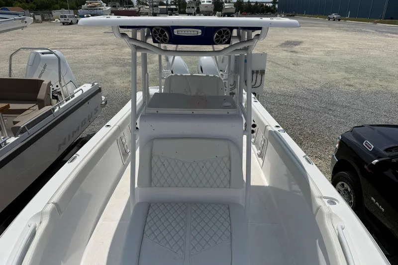 Slide: The Image of 2026 Clearwater 2800 Center Console boat, white interior, parked in a marina. - 5