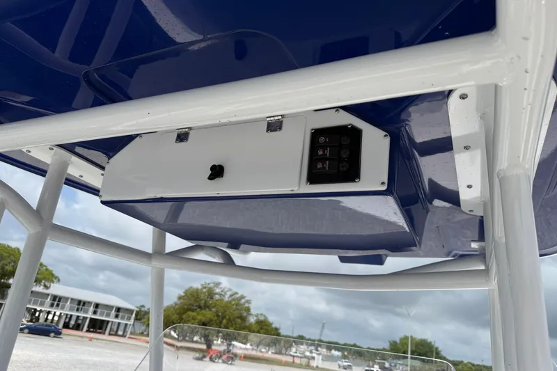 Slide: The Image of 2026 Clearwater 2800 Center Console boat's overhead console with control panel. - 8