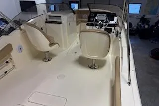 Slide: The Image of 2021 Scout 215 Dorado boat interior with helm and seating area. - 10