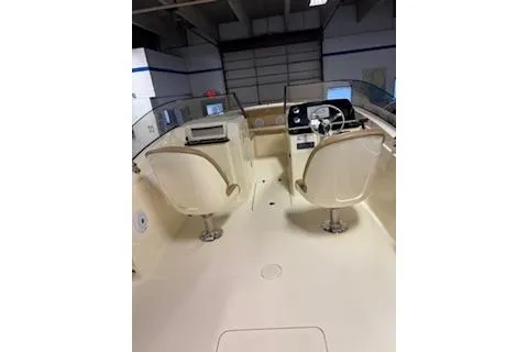 Slide: The Image of 2021 Scout 215 Dorado boat interior with dual helm seats and steering console. - 11