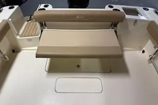 Slide: The Image of 2021 Scout 215 Dorado boat interior with beige seating and storage area. - 13