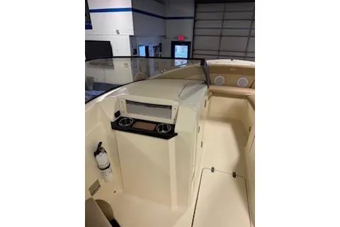 Slide: The Image of 2021 Scout 215 Dorado boat interior with dashboard and seating area. - 17