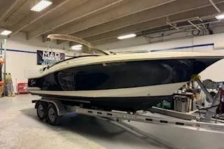 Slide: The Image of 2021 Scout 215 Dorado boat on trailer in indoor storage facility. - 2