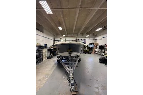 Slide: The Image of 2021 Scout 215 Dorado boat on trailer in a garage setting. - 20
